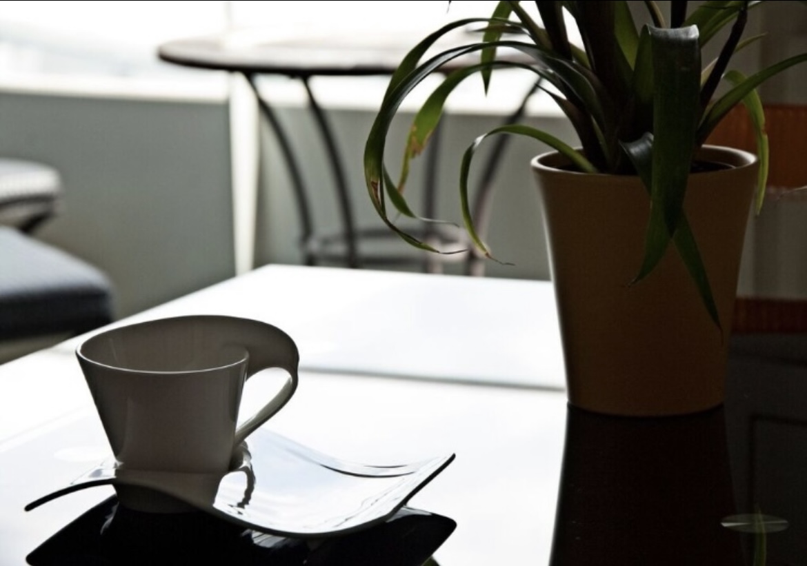 A calm, reassuring moment — coffee on a table